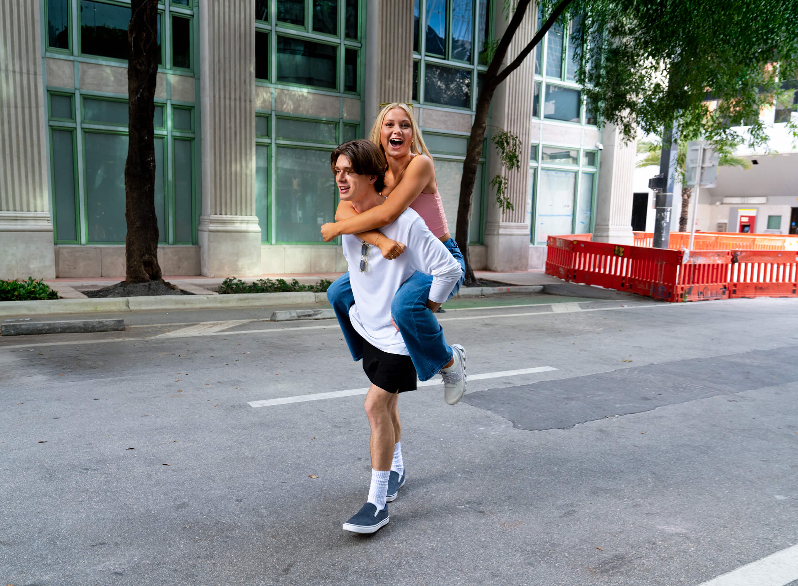 Young woman piggybacking on boyfriend